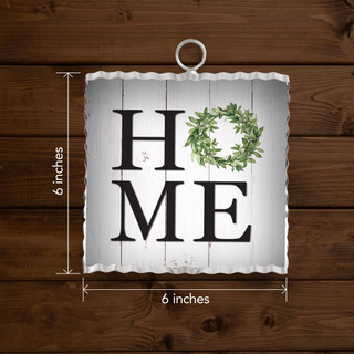 Metal mini moment sign, 6x6 inches, with HOME text and green wreath on white background.