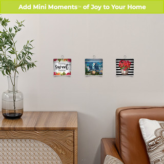 Farmhouse Home Sweet Home Metal Mini Moment decorative wall art with brown leather chair and wooden table.