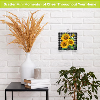 Checkered sunflowers metal mini moment decorative wall art with sunflowers on a white brick background.