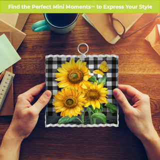 Metal mini moment with checkered sunflowers design, black and white checkered background, yellow sunflowers.