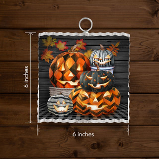 Patterned Jack-O-Lanterns Metal Mini Moment, 6x6 inches, orange, black, and white Halloween decoration with leaves.