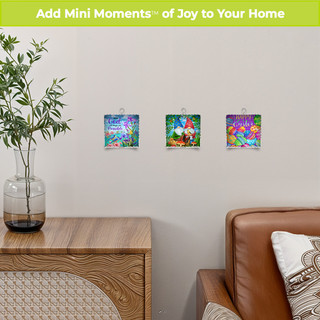With God Metal Mini Moment art pieces hanging on wall near brown leather chair and wood table.