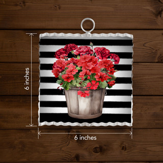 Mini moment garden flag with striped background and red geraniums in a wooden bucket, 6x6 inches.