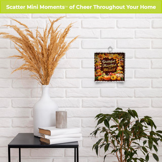 Metal mini moment decor with thankful blessings text on a fall-themed background.