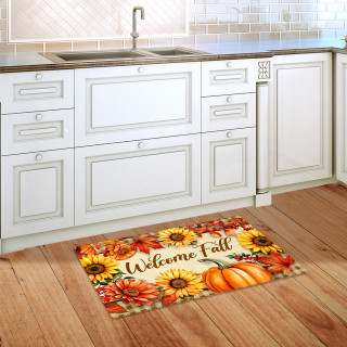 Welcome Fall Flowers Doormat with sunflowers, pumpkins, and fall colors on wooden kitchen floor.