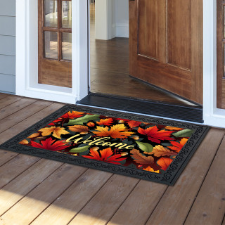 Autumn Color Leaves Doormat with vibrant red, orange, and green leaves and welcome text on porch.