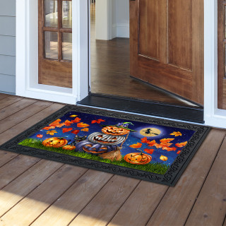 Halloween Pumpkin Stack Doormat on wooden porch with vibrant orange leaves and jack-o-lanterns design.