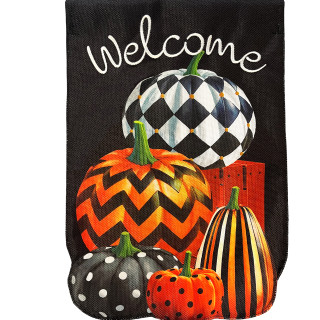 Patterned pumpkins on black burlap garden flag with welcome text in white cursive font displayed.