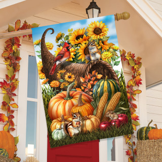 Cornucopia and Critters House Flag with vibrant fall design featuring pumpkins and sunflowers on display.