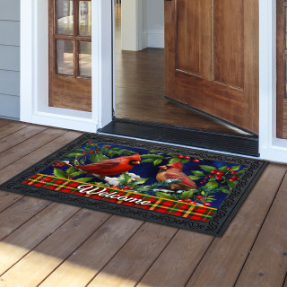 Cardinal and Holly doormat with vibrant red birds, holly, and welcome text on wooden porch.