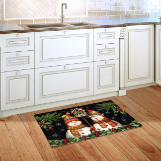 Snowman Pair Doormat on wooden floor in front of white kitchen cabinets with festive holiday design.