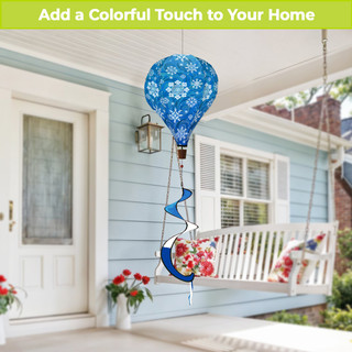 Blue hot air balloon spinner with snowflakes, hanging from a porch ceiling with floral seat.