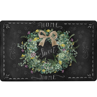 Home Sweet Home Wreath Comfort Mat, black floral design with bow and decorative border.