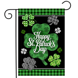 Scattered Shamrocks Garden Flag with Happy St. Patrick's Day text on black with green plaid borders.