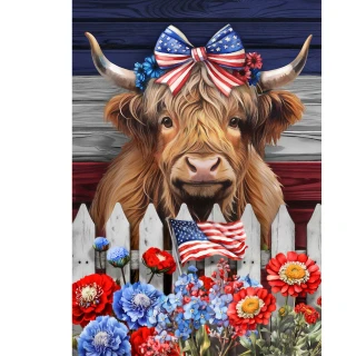 Patriotic Highland Cow Garden Flag with American flag bow and flowers behind white picket fence.