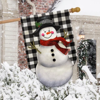 Happy Snowman Burlap House Flag with black and white checkered background and red scarf displayed outdoors.