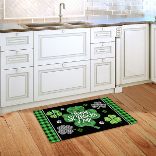 Scattered Shamrocks Doormat with green shamrocks and "Happy St. Patrick's Day" text on black background.