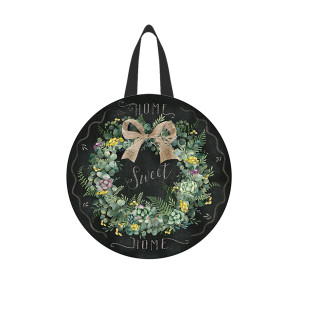 Black round wood door hanger with floral wreath, bow, and Home Sweet Home text.