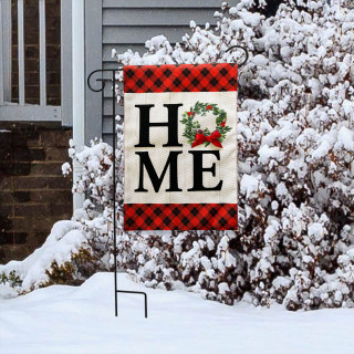 Holiday Home Burlap Garden Flag with red plaid border and festive wreath on snowy display.