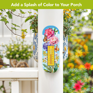 Butterflies and Peonies metal thermometer with colorful floral design and butterflies on a porch post outdoors.