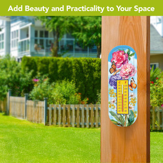 Butterflies and Peonies Metal Thermometer with colorful floral design and butterflies on a wooden post outdoors.