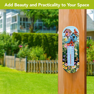 Spring Celebration Birdhouses Metal Thermometer with colorful flowers and birds on a wooden post outdoors.