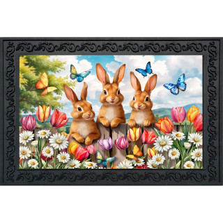 Bunny Greeting Doormat with three brown bunnies, colorful tulips, butterflies, and flowers on a black background.