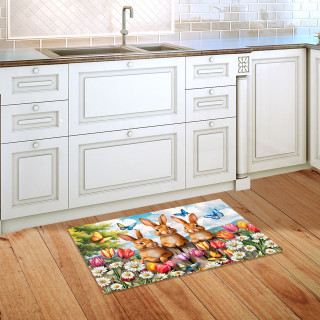 Bunny Greeting Doormat with colorful floral and bunny design on wooden kitchen floor beside sink.
