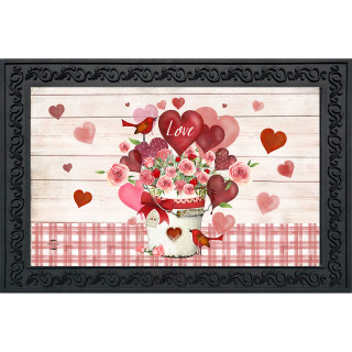 Framed Love Bouquet Doormat with pink flowers, hearts, and red accents on white wood background.