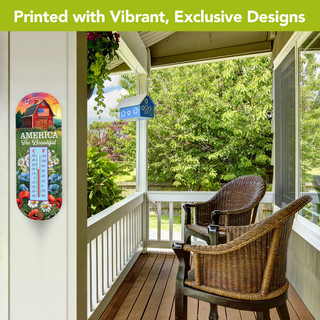 American Barn Metal Thermometer with colorful floral design and temperature gauge on a porch wall.