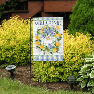Bluebird Lemon Wreath Garden Flag with welcome message and blue bird design on a garden stand.