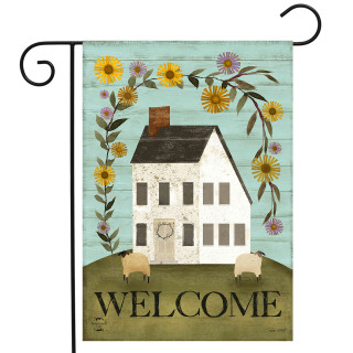 Country Saltbox Garden Flag with white house, colorful flowers, sheep, and welcome text on green hill.