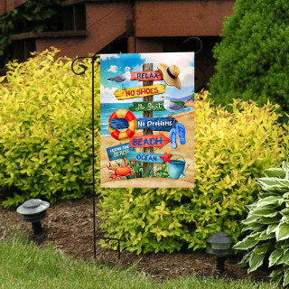 Beach Signs Garden Flag with colorful beach-themed design and phrases on a garden flag stand outdoors.