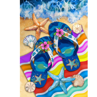 Blue floral flip flops on colorful beach towel with starfish and seashells by ocean waves.