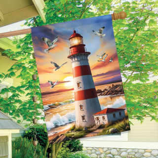 Lighthouse At Sunset House Flag with red, white, and serene coastal scenery design.