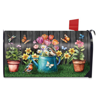 Garden Buddies Mailbox Cover with colorful floral design and butterflies on a wooden fence background.