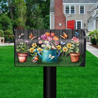 Garden Buddies Mailbox Cover with colorful floral design and butterflies on a black mailbox post outdoors.