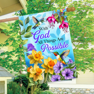 All Things Are Possible house flag with colorful flowers and hummingbirds on blue background hanging outdoors.