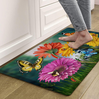 Butteflies and Daisies comfort mat with colorful floral design and butterflies on a green background.