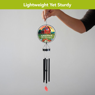 American Barn Illuminated Wind Chime with colorful design and black tubes, featuring a red pendant.