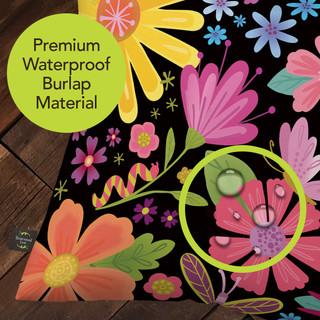 Spring Fling Indoor/Outdoor Pillow, colorful floral waterproof burlap material, vibrant flowers on black background shown.