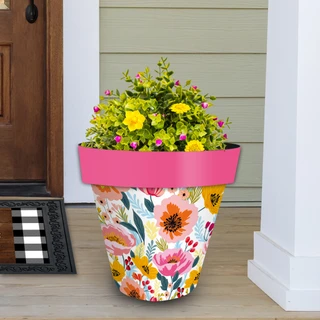Vibrant Blooms Large Planter with pink rim and colorful floral design holding green and yellow flowers.