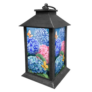 Colorful Hydrangeas Lantern with blue, pink hydrangeas and butterflies on a black metal frame base.