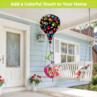 Rainbow Pawprints Welcome Hot Air Balloon Spinner with colorful paw prints and flowers hanging from porch.