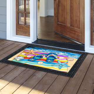 Colorful beach-themed Flip Flop Haven Doormat on wooden porch outside open door with black border.