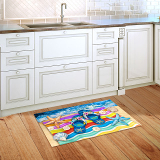 Multicolored Flip Flop Haven Doormat on wooden floor in front of white kitchen cabinets.