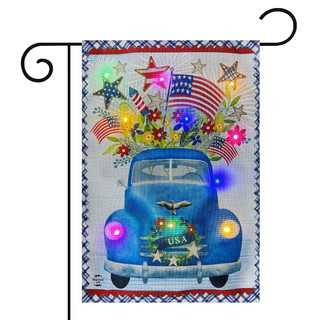 Blue pickup truck garden flag with LED lights, stars, flowers, and American flags on burlap.