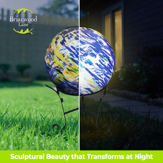 Blue and green rippled solar LED glass gazing ball on stand, lit and unlit display.