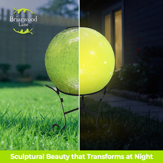 Green Cracked Solar LED Glass Gazing Ball, illuminated and unlit, on stand, vibrant green color.