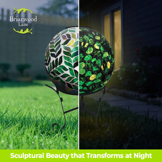 Green Leaves Solar LED Mosaic Gazing Ball with leaf design, illuminated and unlit, on a stand.